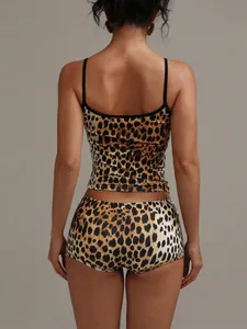Detail back view of a sexy leopard print two-piece loungewear set with camisole tops.