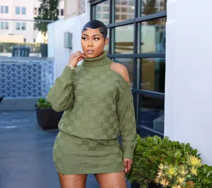 Chic olive green checkered knit skirt set with one-shoulder cutout detail on a model.