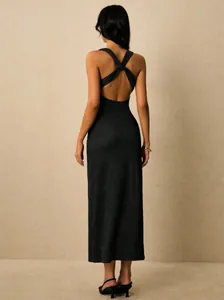 Detailed rear view of elegant black rib-knit midi dress with a backless twist design