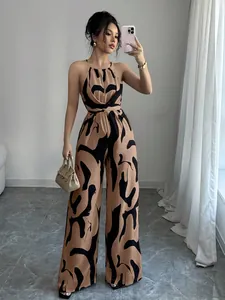 Elegant brown and black abstract print halter-neck wide-leg jumpsuit for stylish women