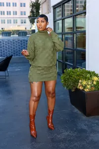 Close-up detail of a stylish olive green two-piece checkered knit sweater and mini skirt set