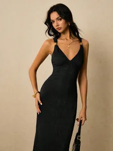 Elegant black ribbed bodycon maxi dress featuring stylish decorative gold accents on straps