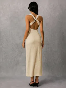 Detail view of the elegant beige backless ribbed midi dress with criss-cross straps.