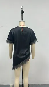 Back view of elegant black satin short sleeve top featuring delicate lace trim on mannequin