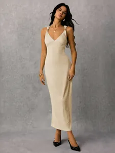 Elegant beige ribbed maxi dress with sleeveless V-neck design for a sophisticated look