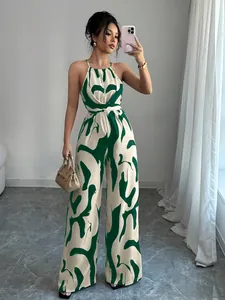 Detailed view of a stylish green abstract print halter neck wide-leg jumpsuit