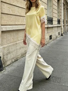 Detailed view of French style satin short sleeve T-shirt with white lace patchwork