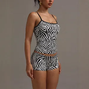 Two-piece women's zebra print loungewear set featuring a camisole top and matching shorts