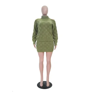 Close-up of olive green checkered knit two-piece set with cold shoulder sweater detail