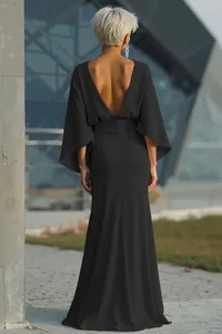 Elegant black backless maxi dress with pleated waist and flowing cape sleeves