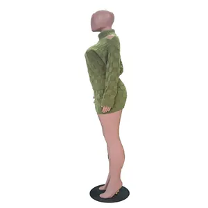 Side view of olive green checkered knit two-piece skirt set with cutout shoulder