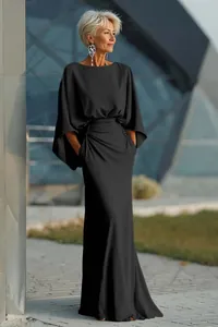 Elegant black evening maxi dress featuring batwing sleeves and ruched waist with pockets