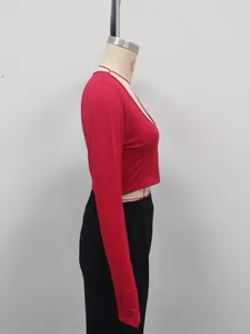 Side view of a slim-fit red long-sleeved cropped T-shirt for a chic look.