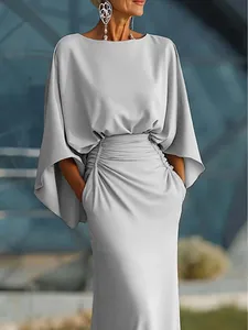 Elegant silver-grey pleated maxi dress with batwing sleeves and functional pockets
