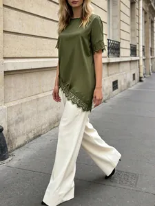 Elegant olive green satin top with lace trim detail for a chic French summer street look.