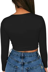 Back view of a black slim fit cropped long sleeve T-shirt with denim jeans