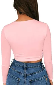 Back view of pink long sleeve crop top with slim fit design and soft cotton fabric