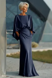 Elegant dark blue pleated satin maxi dress with cape sleeves for formal events