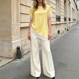 Elegant French yellow satin top with lace trim and asymmetrical hem for summer style.