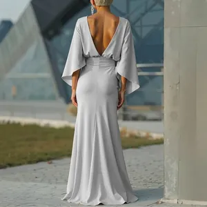 Elegant silver backless pleated maxi dress with wide sleeves for a sophisticated look