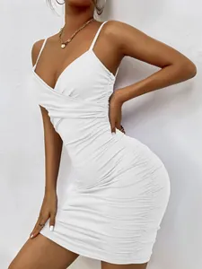 Close-up of white ruched V-neck bodycon mini dress with spaghetti straps