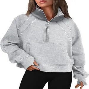 Detailed view of women's gray half-zip sweatshirt featuring a stylish high collar