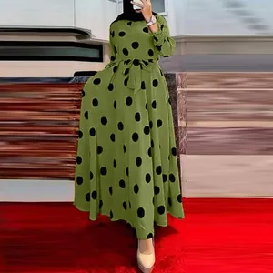 Modest olive green maxi dress featuring large black polka dots and long sleeves