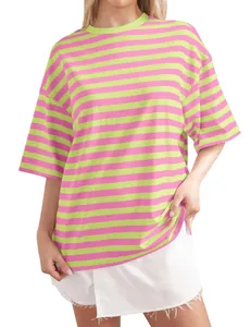 Close-up of women's casual oversized striped t-shirt with crew neck and pink-green pattern