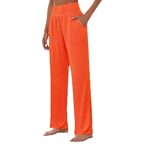 High-waisted wide-leg yoga pants for women in vibrant orange featuring side pockets