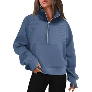 Women's casual blue half-zip sweatshirt featuring stand collar and thumbhole sleeves