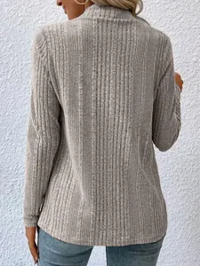 Back view of a grey long-sleeved ribbed knit sweater with textured fabric detail