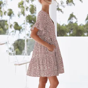 Detailed side view of pink floral V-neck dress with ruffled sleeves and pockets