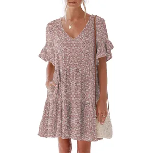 Detailed view of women's pink floral V-neck dress with ruffle sleeves and handy side pocket