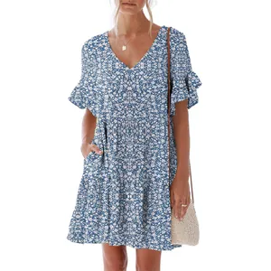 Detail view of women's blue floral V-neck dress with ruffle sleeves and pockets