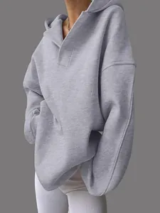 Detailed view of light gray oversized hoodie with a unique V-neck hooded collar