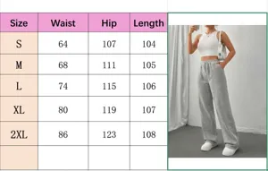 Tableau des tailles pour pantalon de survêtement gris à taille haute et jambe large.