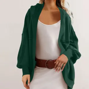 Detailed view of a stylish green oversized hooded cardigan with high-quality fabric texture