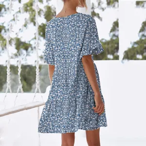 Back view of blue floral short-sleeved mini dress with tiered ruffle hem detail