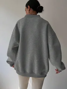 Detailed back view of a grey oversized round neck sweatshirt for casual women wear