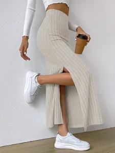 Elegant beige high-waisted ribbed knit maxi skirt with stylish side slit detail