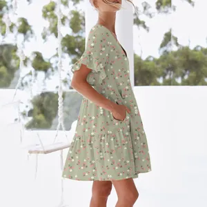 Detail of women's V-neck floral summer dress with ruffle sleeves and pockets