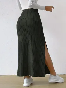 Detailed view of high-waist rib-knit maxi skirt with stylish side slit detail.