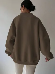 Detailed back view of a premium brown oversized sweatshirt featuring dropped shoulders