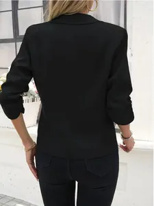 Back view of elegant black notched lapel mid-sleeve blazer showing a slim fit silhouette
