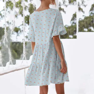 Back view detail of women's blue cherry print dress with ruffle sleeves and loose fit