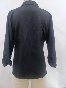 Detailed back view of a classic black business blazer with lapel collar on mannequin