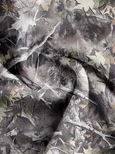Detailed close-up showing the realistic woodland camouflage print on the high-quality fabric