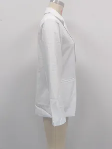 Side view detail showing the sleeve and silhouette of a white oversized blazer jacket