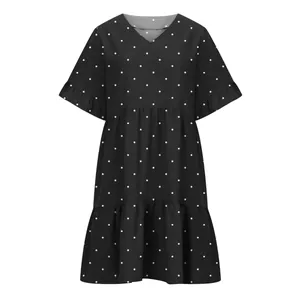 High-quality close-up showing the V-neck and ruffle sleeve detail of a polka dot dress