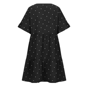 Detailed back view of a black tiered polka dot dress featuring elegant ruffled sleeves